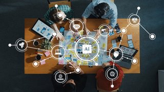 Collaborative Team Workshop Focused on AI Technology Development with Digital Tools and Ideas on a Wooden Table. Amity
