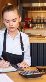 small restaurant owner calculating expenses