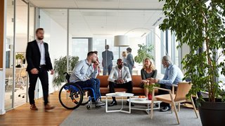 Diverse Executive Team Meeting in Office Reception Room