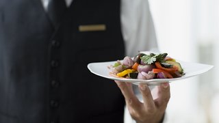Waiter holding plate Waiter holding plate