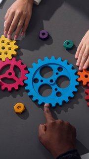 Business team connect pieces of gears. Teamwork, partnership and integration concept