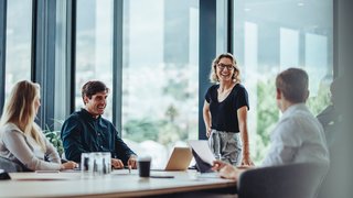 Business people having casual discussion during meeting