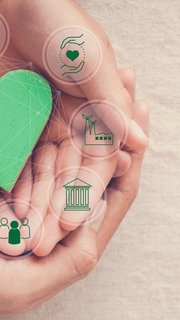 Hands holding green heart with eco circular economy icons, CSR social responsibility, ESG, eco green sustainable living concept, world environmental day