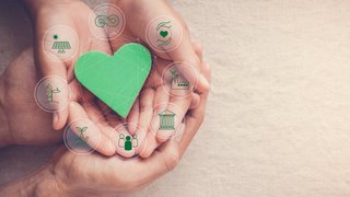 Hands holding green heart with eco circular economy icons, CSR social responsibility, ESG, eco green sustainable living concept, world environmental day