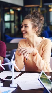 Young coworkers talking at conference table